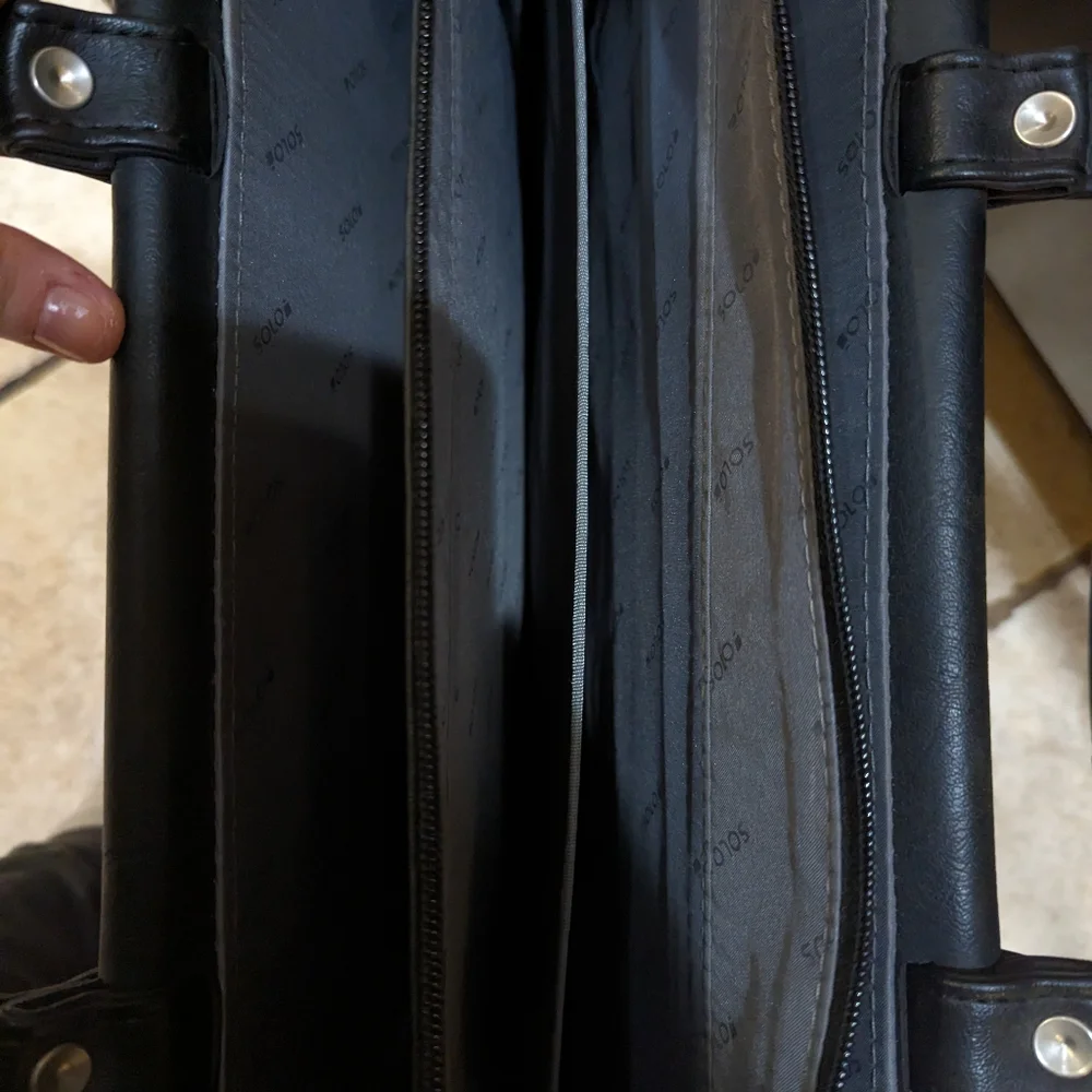 Solo brand black leather briefcase new never used. Missing shoulder strap.
